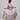 Girl in tiered Dubai-print maxi dress with lace panels and open-back tie.