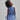 Girl in azure sequin lace dress with dramatic flared tulle hem.