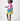 Girl in pink top and Dubai desert print skirt with front buttons.