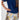 Girl in navy velvet and floral brocade dress with puff sleeves and scalloped detail.