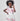 Girl in taffeta A-line dress with flamingo print, tulle sleeves, and back bow.