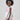 Girl in taffeta A-line dress with flamingo print, tulle sleeves, and back bow.