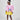 Girl in colour-block crinkle taffeta dress with yellow hem and pink sleeves.