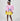 Girl in colour-block crinkle taffeta dress with yellow hem and pink sleeves.