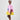 Girl in colour-block crinkle taffeta dress with yellow hem and pink sleeves.