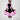 Girl in black velvet dress with pink organza ruffles and voluminous skirt.