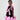 Girl in black velvet dress with pink organza ruffles and voluminous skirt.