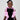 Girl in black velvet dress with pink organza ruffles and voluminous skirt.