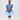 Girl wearing soft blue embroidered lace dress with puff sleeves and tulle hem.
