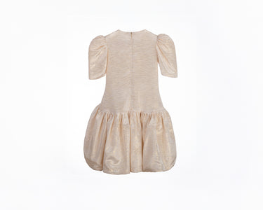Champagne gold girls party dress with gathered skirt and puff sleeves—back view of Amber Dress.
