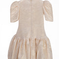 Champagne gold girls party dress with gathered skirt and puff sleeves – back view of Amber Dress.
