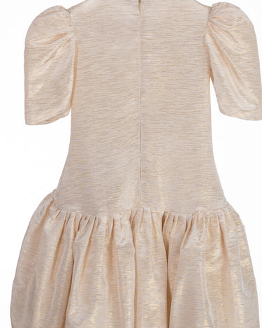 Champagne gold girls party dress with gathered skirt and puff sleeves – back view of Amber Dress.