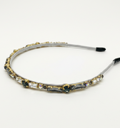 Decorative headband with gemstones on a white background