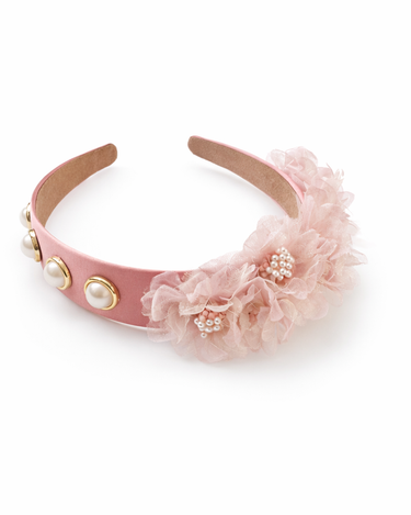 Pink headband with floral design and gold accents on a white background