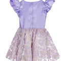 Lilac high-low occasion dress with petal-shaped white flower and floral brocade skirt – Bloomlight Dress for girls aged 5–14.