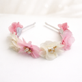 Floral headbands with pink and white flowers on a white background