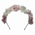 Floral headband with pink and white flowers on a white background