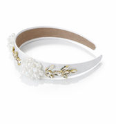 Decorative headband with pearls and gold accents on a white background