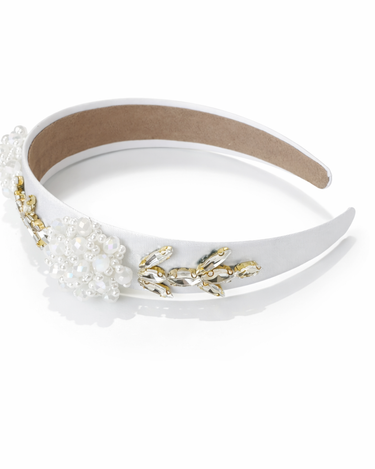Decorative headband with pearls and gold accents on a white background