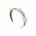 Pearl and gold headband on a white background