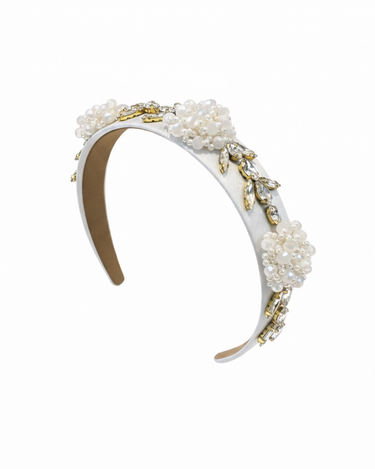 Pearl and gold headband on a white background
