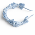 Blue satin knot headband for girls with sculpted knot detailing