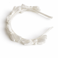 White satin knot headband for girls with sculpted knot detailing