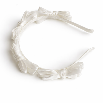 White satin knot headband for girls with sculpted knot detailing