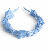 Blue satin knot headband for girls with sculpted knot detailing