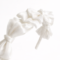 White satin knot headband for girls with sculpted knot detailing