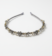 Silver headband with decorative elements on a white background