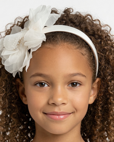 Ivory satin headband with layered organza petals and crystal centre detail for girls aged 2 to 12 years