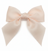 Large pink hair bow on a white background