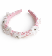 Pink satin headband with guipure lace overlay and crystal-centred floral appliqués for girls aged 2–12 years
