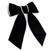 Black bow with pearl accents on a white background