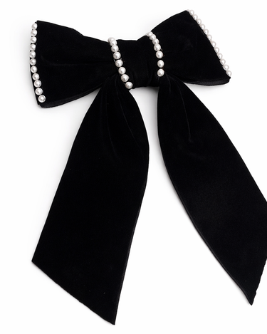 Black bow with pearl accents on a white background