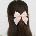 Luxury pearl trim signature bow hair clip for girls