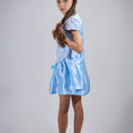 Girl in royal blue taffeta dress with sequin lace front and velvet bow accents.