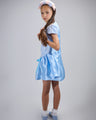Girl in royal blue taffeta dress with sequin lace front and velvet bow accents.