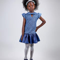 Girl in sequined lace and denim-look taffeta dress with flutter sleeves.