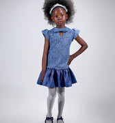 Girl in sequined lace and denim-look taffeta dress with flutter sleeves.