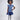 Girl in sequined lace and denim-look taffeta dress with flutter sleeves.