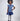 Girl in sequined lace and denim-look taffeta dress with flutter sleeves.