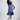 Girl in sequined lace and denim-look taffeta dress with flutter sleeves.