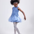 Girl in azure sequin lace dress with dramatic flared tulle hem.
