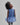 Girl in azure sequin lace dress with dramatic flared tulle hem.