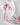 Girl in taffeta A-line dress with flamingo print, tulle sleeves, and back bow.