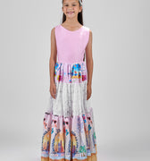 Girl in tiered Dubai-print maxi dress with lace panels and open-back tie.