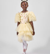 Product photo of a young girl modeling a yellow floral dress with ruffled sleeves, part of the Rehoboth Kidz summer collection, against a white background