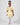 Product photo of a young girl modeling a yellow floral dress with ruffled sleeves, part of the Rehoboth Kidz summer collection, against a white background